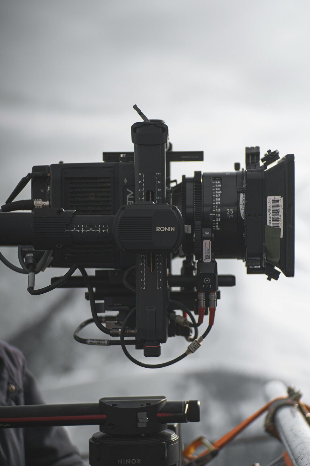 Television studio set with cameras and bright lighting rigs