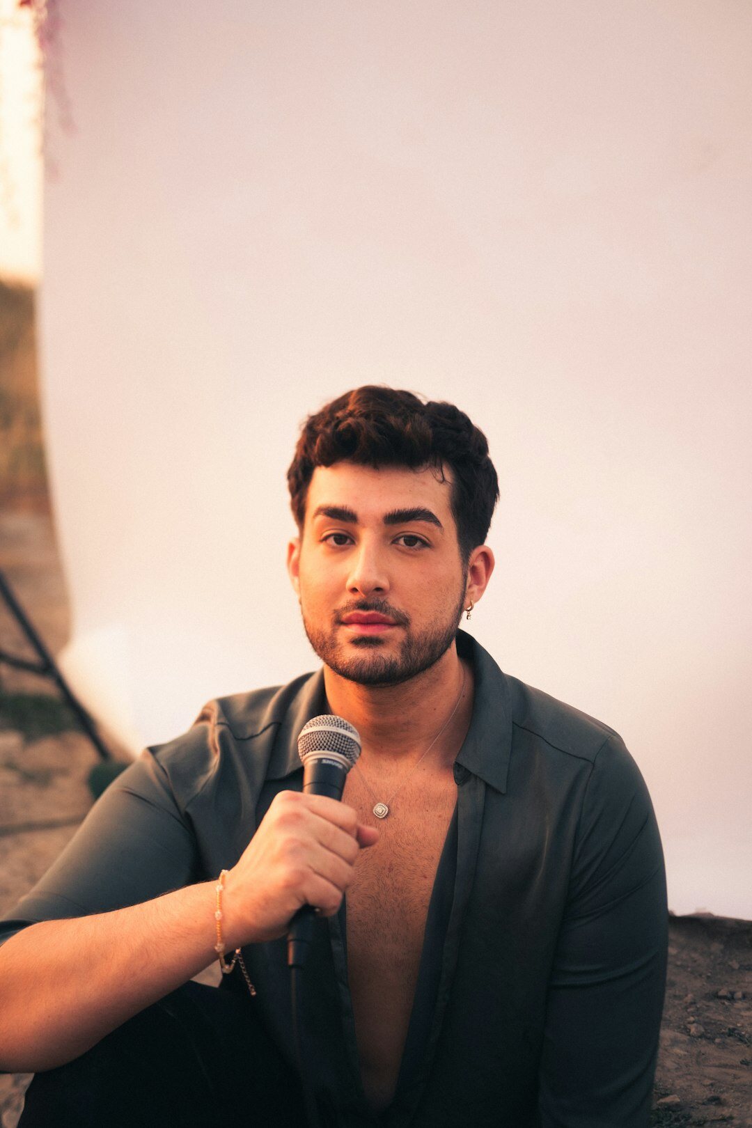 Reporter holding a microphone during a celebrity interview
